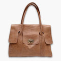 Handcrafted Moroccan leather bag purse in natural brown, featuring traditional stitching and a minimalist design, made from eco-friendly materials