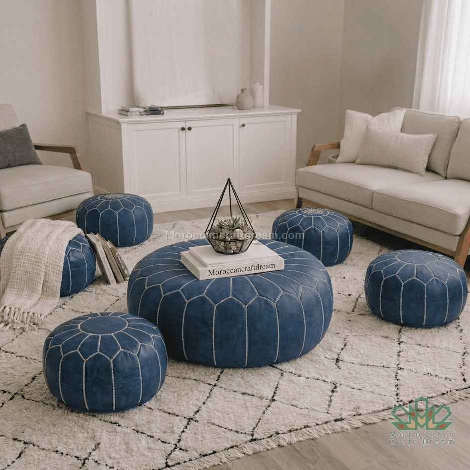 Living room with blue poufs and a white sofa on a patterned rug.